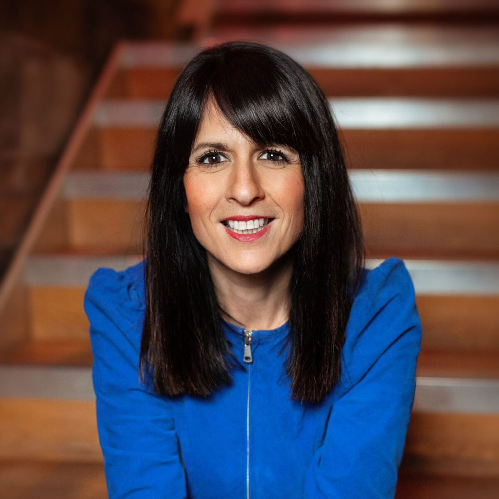 Katie Posner smiling and looking at camera